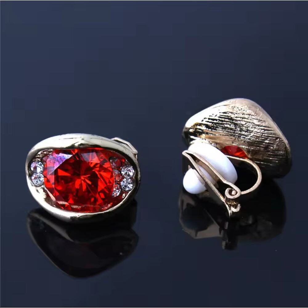 Clip on 1/2" small gold,  red  and clear stone earrings